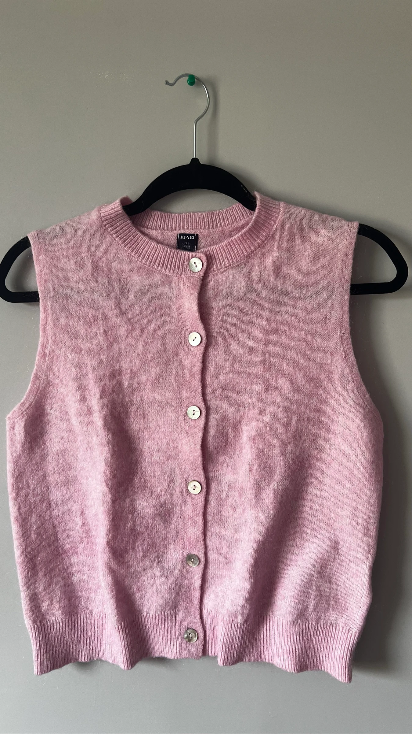 Haut en laine rose clair 